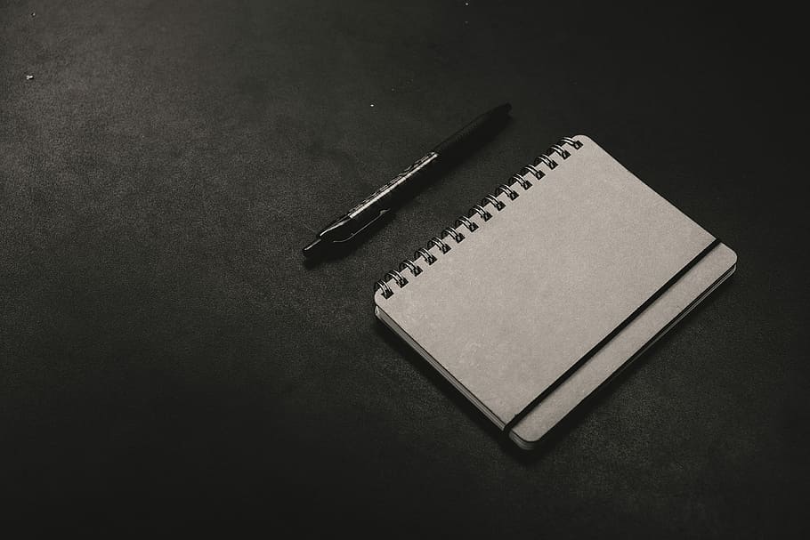 black click pen beside notebook, white notebook with pen on floor HD wallpaper