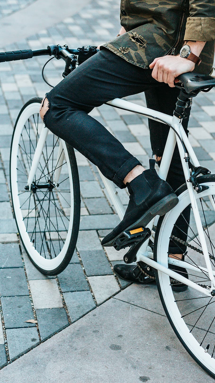 man wearing black pants riding white commuter bike, man riding bike wearing chelsea boots, HD wallpaper