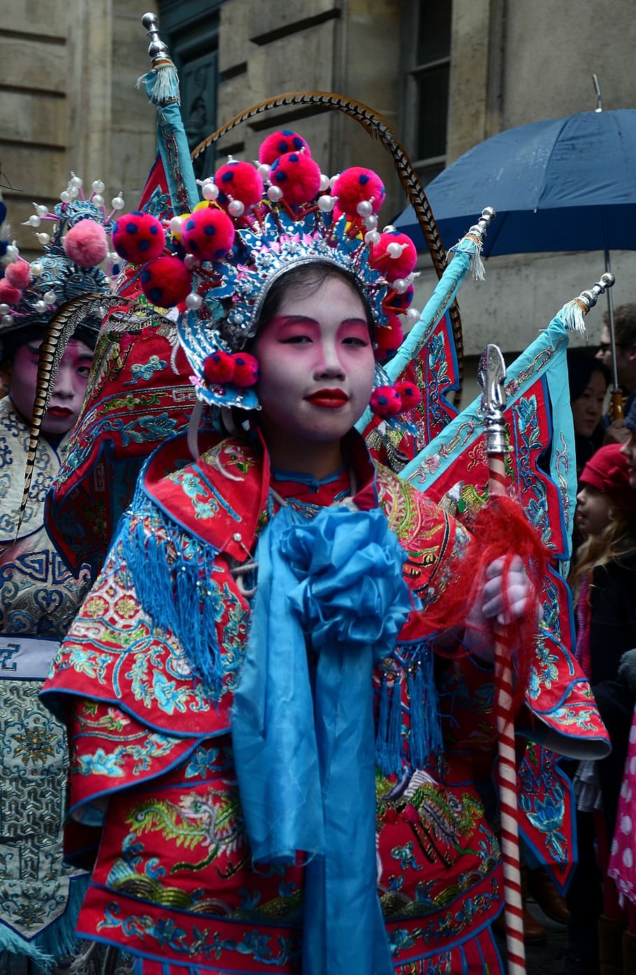 woman wearing red and blue traditional dress, paris, france, chinese new year