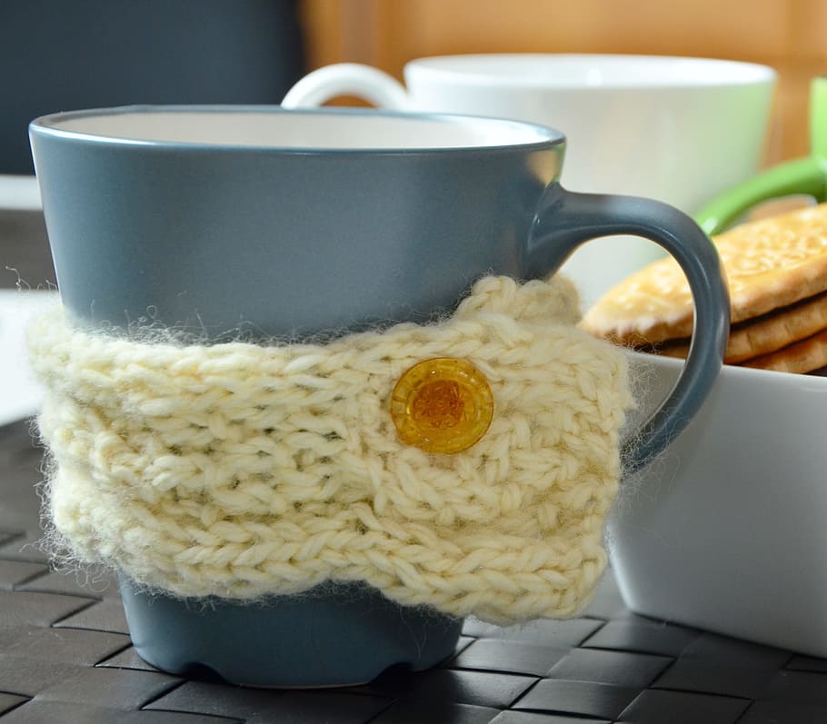 yellow knitted stubby holder wrapped around grey mug, hand labor HD wallpaper