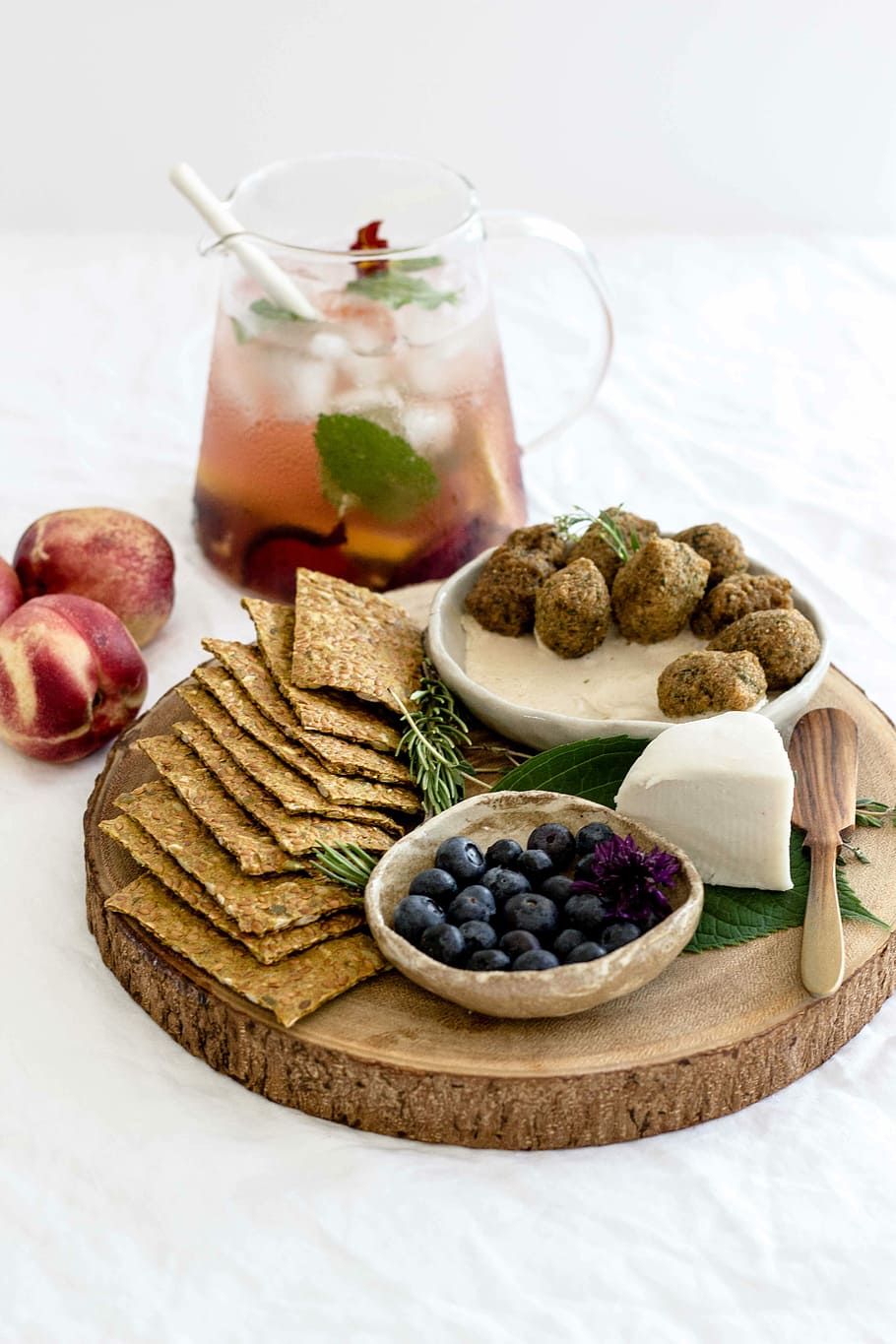 assorted-cook foods on round brown wooden tray, variety of foods on white textile HD wallpaper