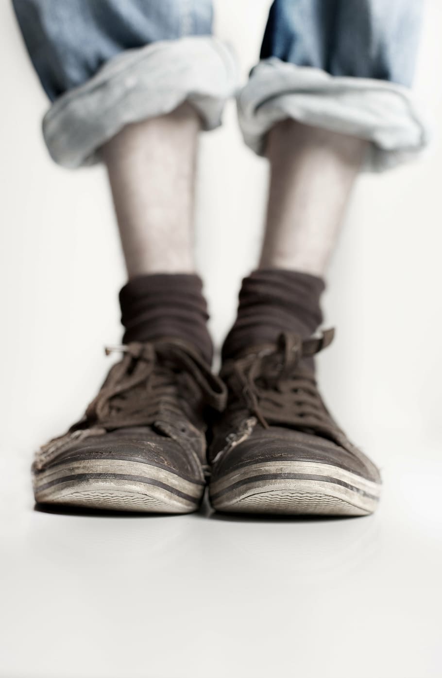 person wearing brown shoes in tilt shift photography, legs, feet