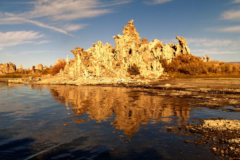 landscape photography of a mountain and body of water, Tufa, Tuff