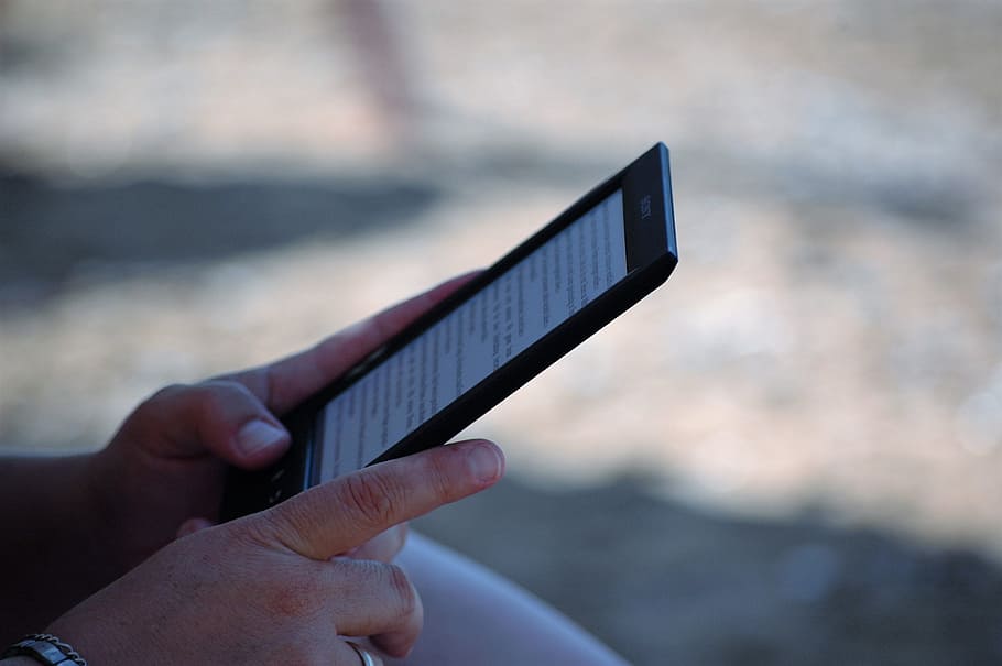 selective focus photography of person using E-book reader, ebook HD wallpaper