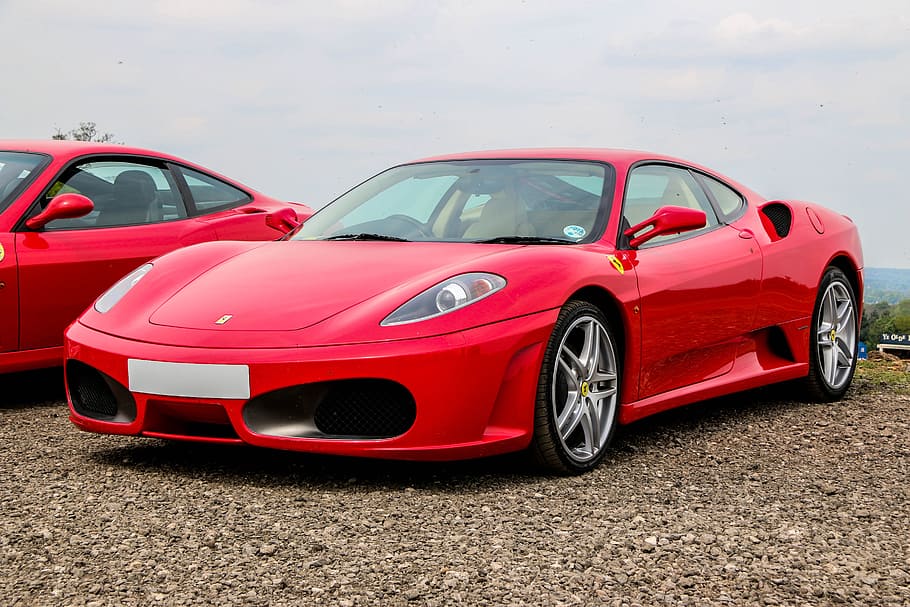 red Ferrari sports coupe beside red coupe at daytime, supercar, HD wallpaper