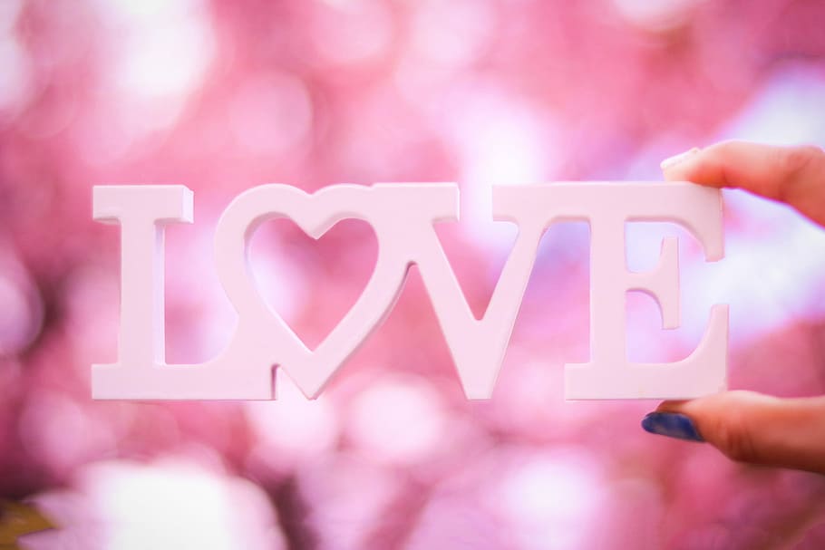 person holding white Love free standing letter, human Hand, defocused HD wallpaper
