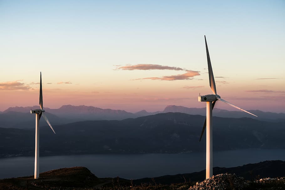 two white wind turbines during daytime, lake, mountain range HD wallpaper