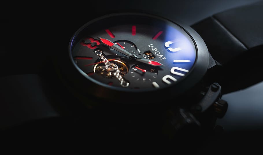 round black U-Boat chronograph watch with black strap, clock