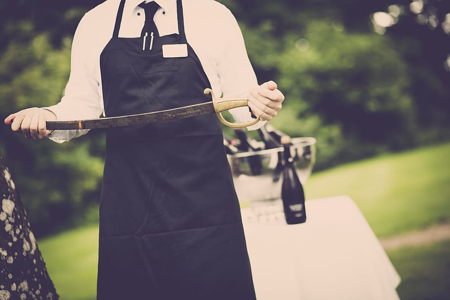 Man Wearing Apron Holding Sword, bottle, dangerous, outdoors HD wallpaper