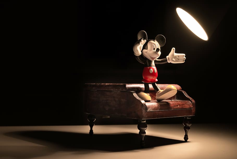 Mickey Mouse figure standing on grand piano miniature, spotlight, HD wallpaper