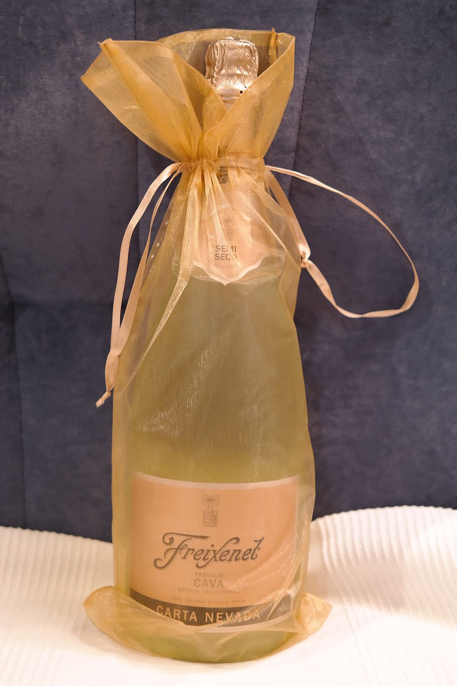 Freixenet Carta Nevada bottle in brown drawstring pouch, champagne