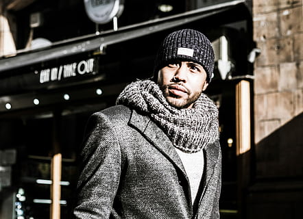 woman in gray suit jacket, man wearing black knit scarf and cap HD wallpaper
