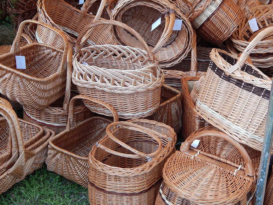 stacks of brown wicker baskets on green grass, handicraft, large group of objects HD wallpaper