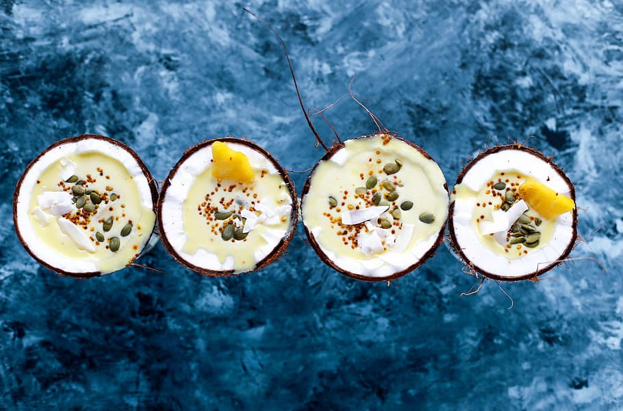 flat-lay photography of four coconut desserts, four coconuts with fillings HD wallpaper