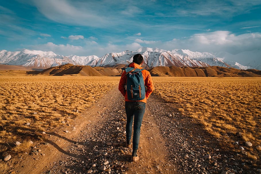 man walking nearby mountains, valley, holiday, standing, one person HD wallpaper