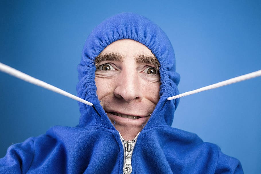 man wearing blue zip-up hoodie, people, whimsical, lazy, fashion