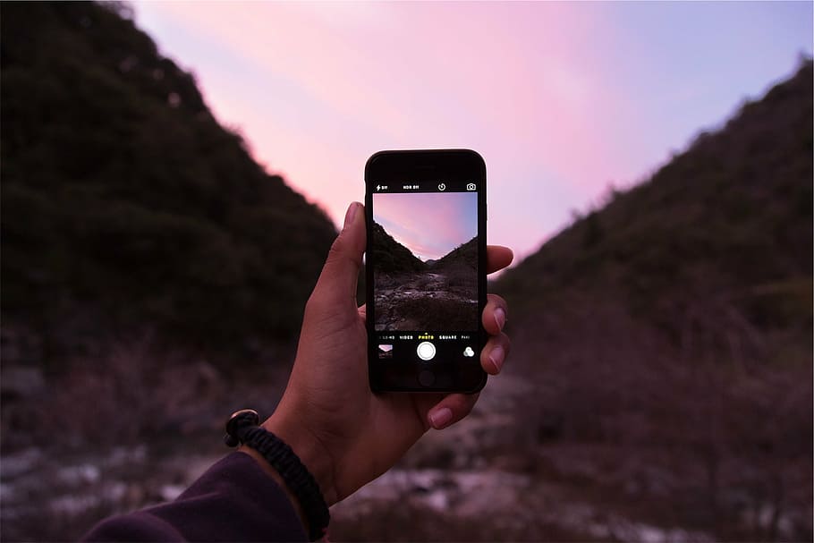 person holding black smartphone taking photo of mountain, space, HD wallpaper