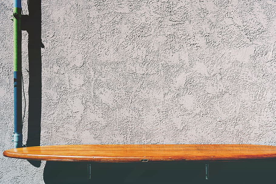 brown wooden board, surfboard, table, concrete, wall, no people HD wallpaper