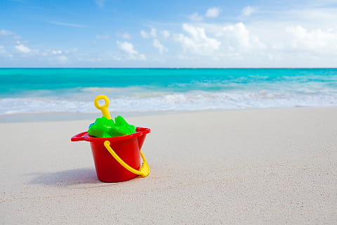 red and yellow plastic pail and shovel near the ocean, sand HD wallpaper