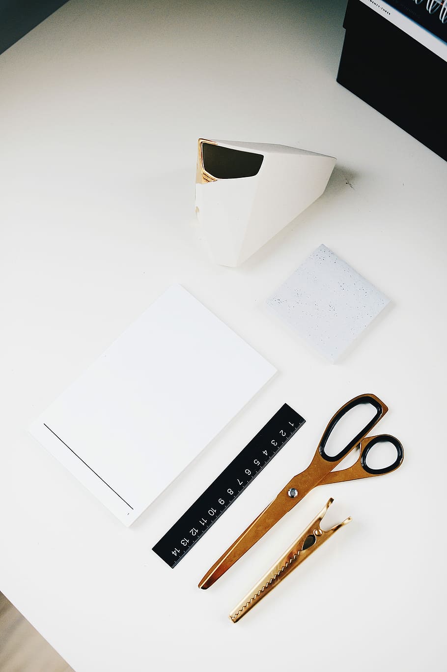 brown scissor beside clip and white printer paper on white surface, assorted crafting tool on top of the table HD wallpaper