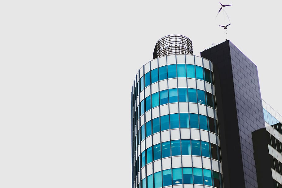 low-angle photography of glass building under gray clouds, architecture HD wallpaper