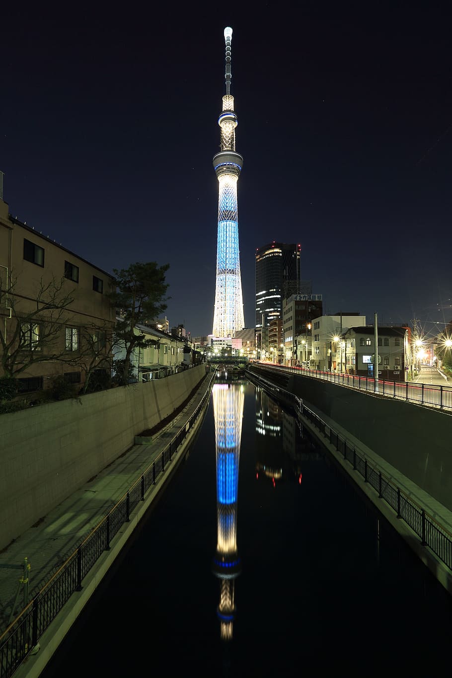 blue and white lighted tower during night time, grey lighted tower under sky at nighttime HD wallpaper