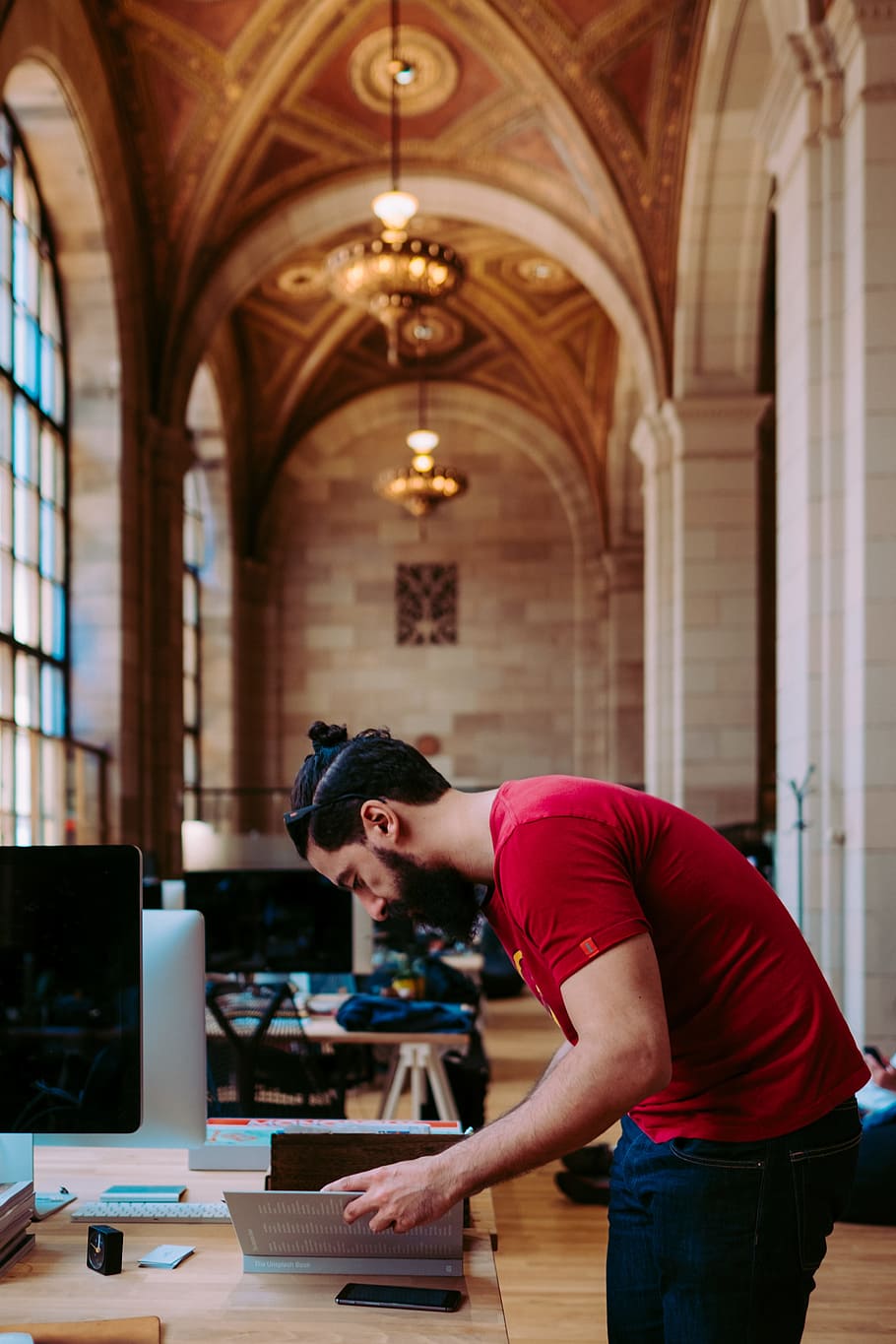 shallow focus photogoraphy of man looking down to his book, Unsplash HQ, Crew collective & Cafe, Montreal HD wallpaper