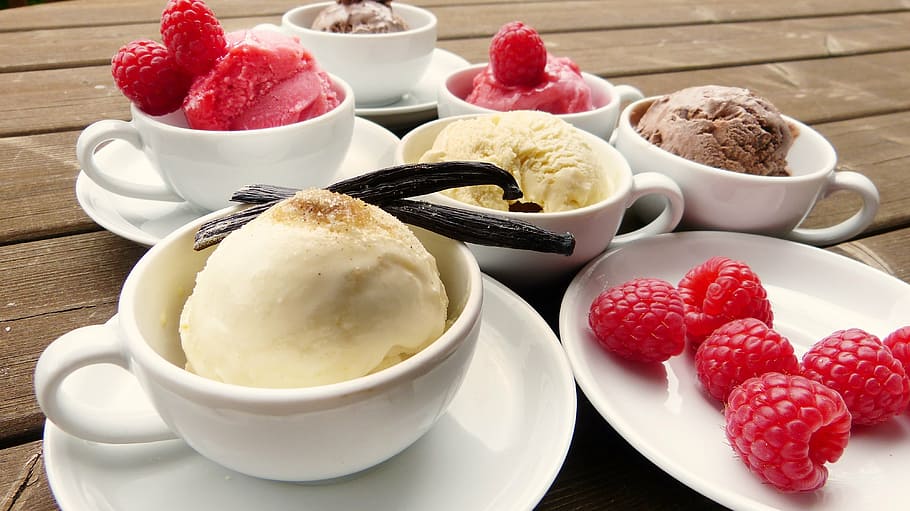 raspberries served in white plate, ice, ice cream, vanilla pod