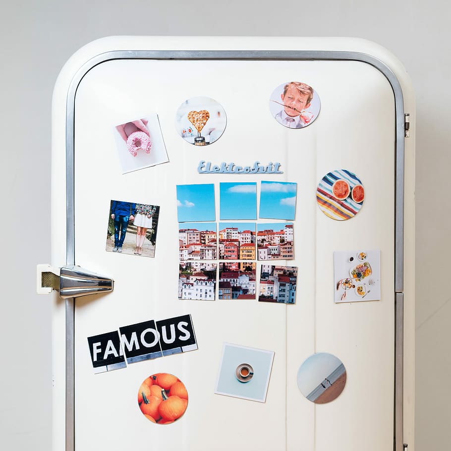 assorted-type photos stick on white single-door refrigerator, white plastic container with pictures