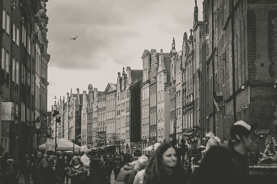 grayscale photography of people, grayscale photography of people between high rise buildings HD wallpaper