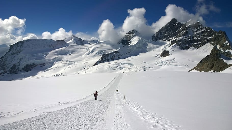 man standing on snow field, winter, mountain, blue, sky, cold temperature HD wallpaper