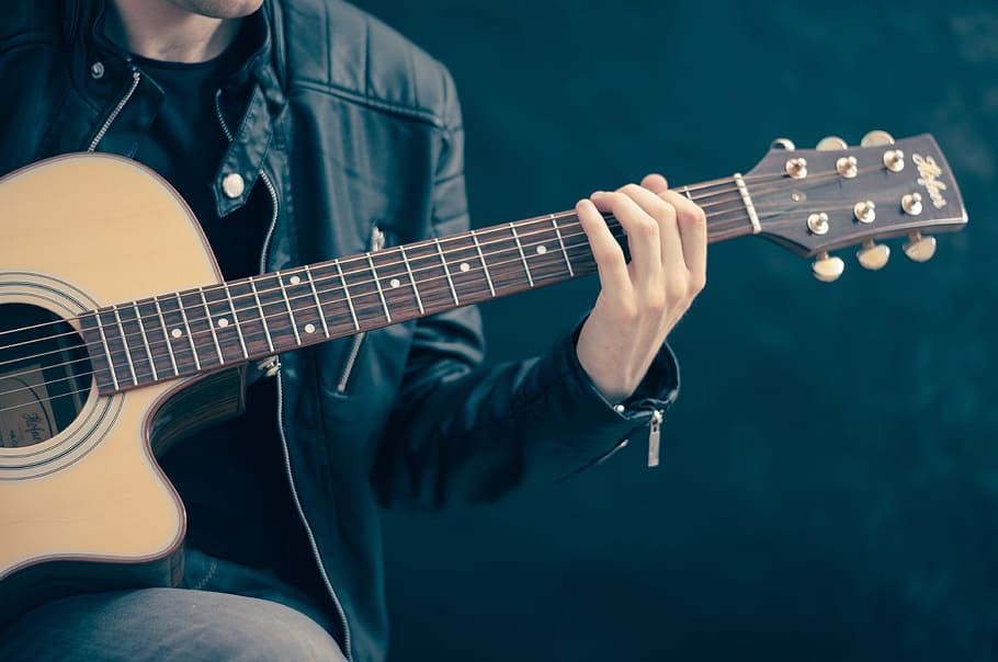person holding guitar, classical guitar, acoustic guitar, electric guitar