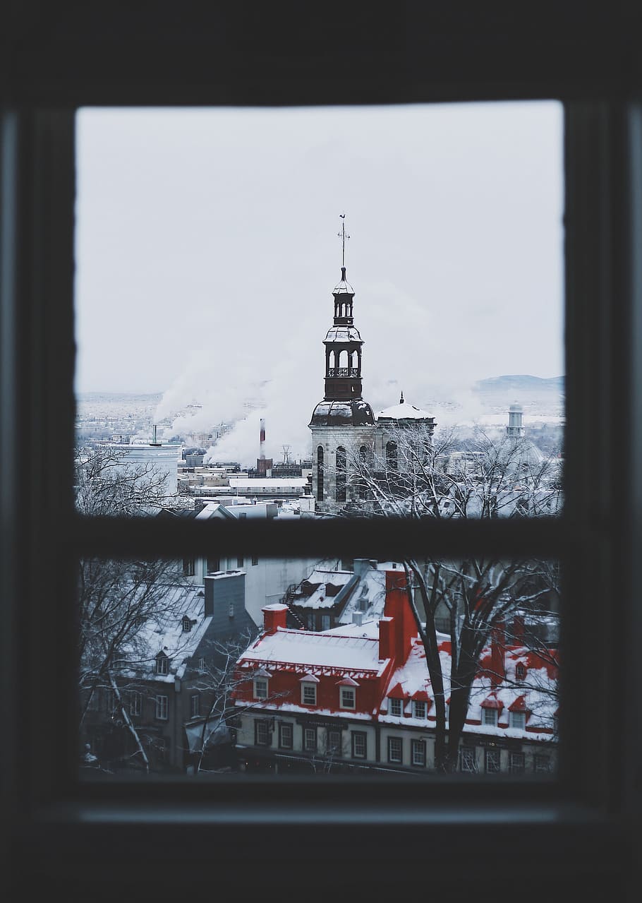 brown and white tower building near smoke at daytime, selective color photography of window view of concrete houses and buildings HD wallpaper
