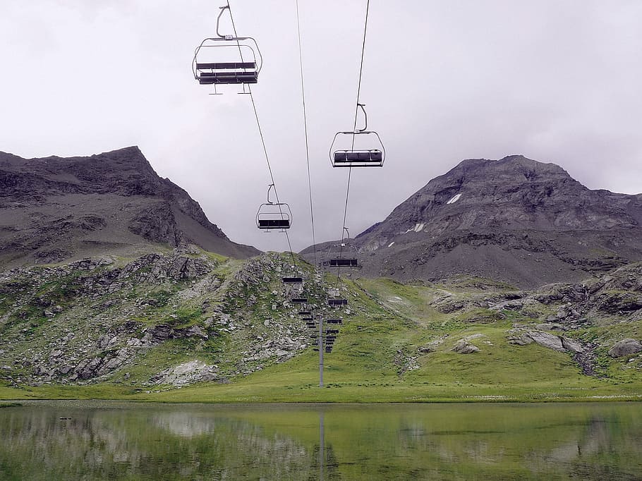 low-angle photography of cable cars, cable car over green grass field, HD wallpaper