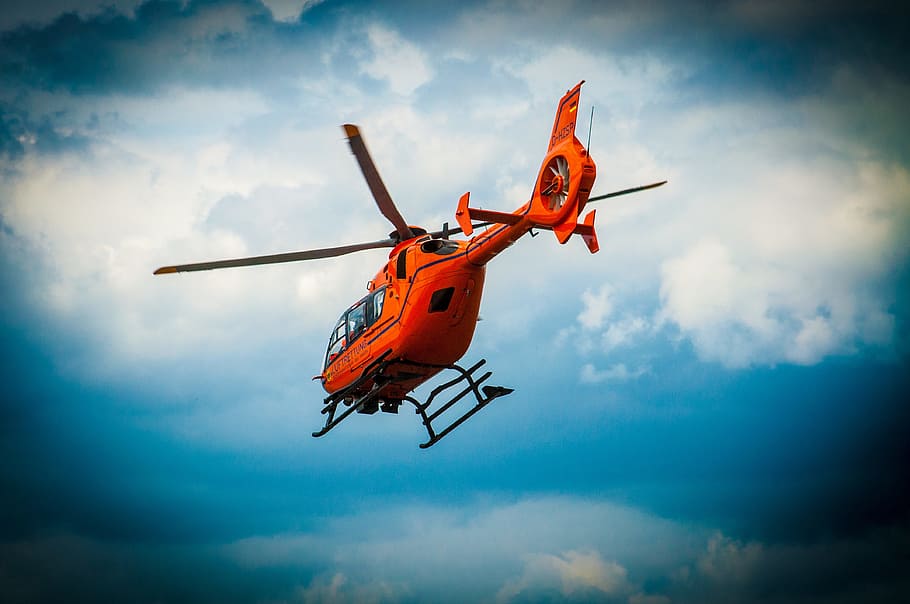 orange helicopter on air, red, rotor, ambulance service, rescue helicopter