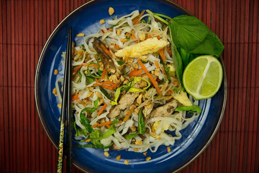 Overhead shot of Pad Thai noodles with chopsticks, food/Drink