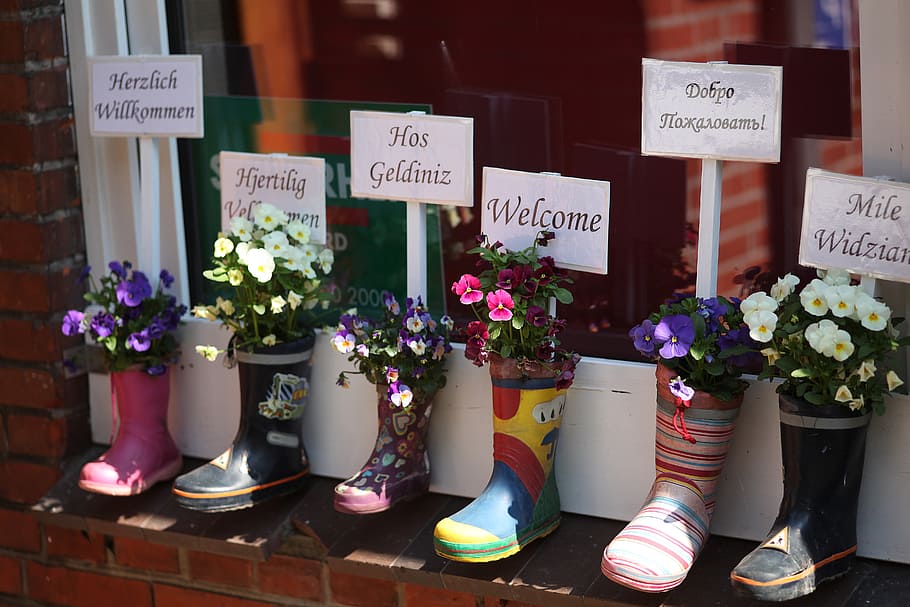 six unpaired rain boots on brown concrete wall, kindergarten HD wallpaper