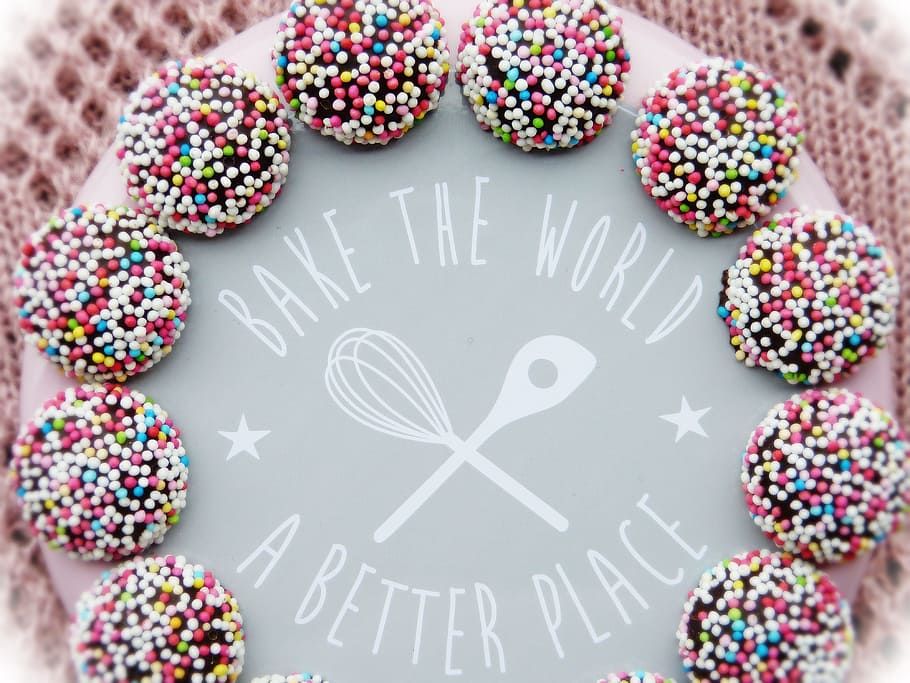 close-up of a pink icing covered cake, bake, motto, world, improve HD wallpaper