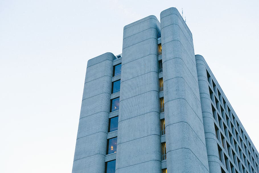 man's eyeview of multi-storey building, architectural photography of grey concrete building HD wallpaper