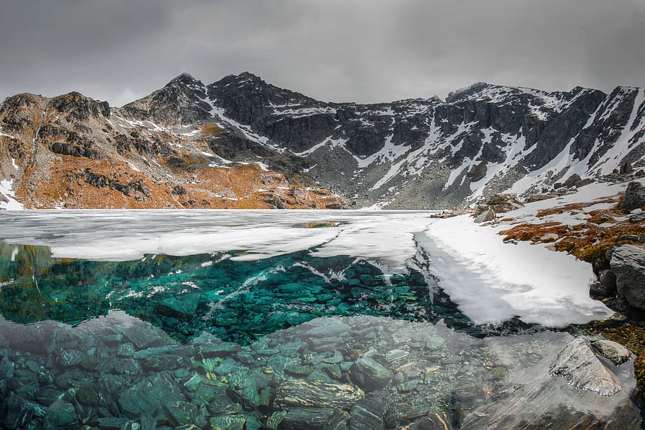 landscape photography of mountains, snow mountains under gray sky HD wallpaper