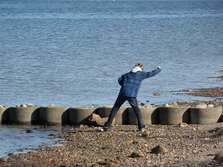 beach, stones, water, sea, real people, one person, leisure activity HD wallpaper