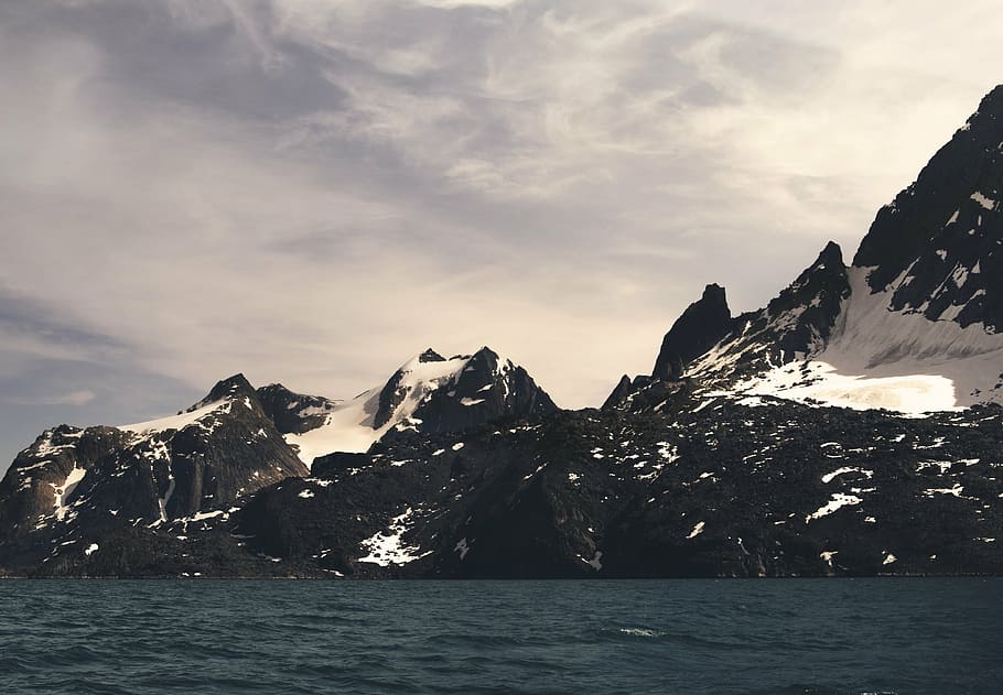 mountain covered by snow beside body of water, coast, shore HD wallpaper