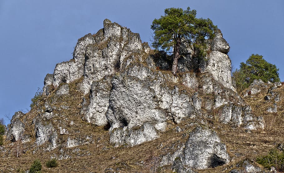 rock, rock wall, steep, mountain, romantic, blue sky, clouds HD wallpaper