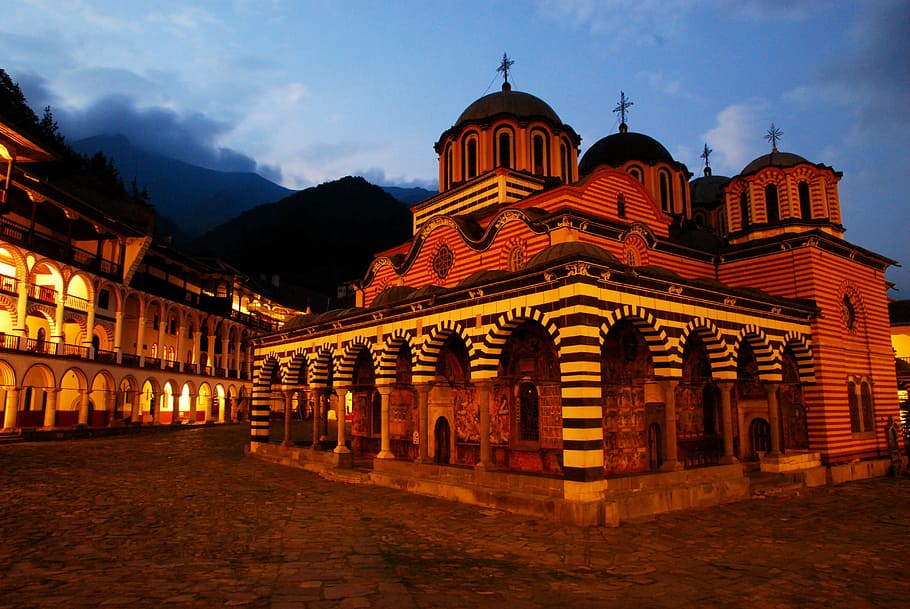 gray concrete mosque under blue sky, rila monastery, bulgaria