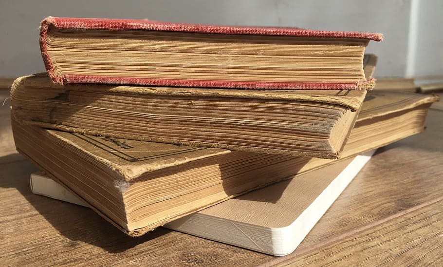 four assorted books on brown wooden surface, old, old book HD wallpaper