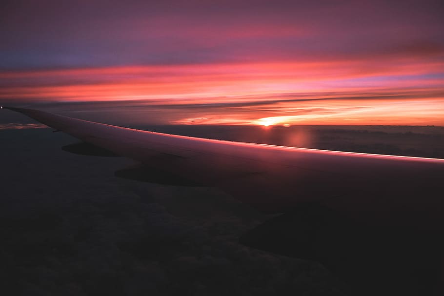 view of orange sunset from airplane, left airplane wing during sunset HD wallpaper
