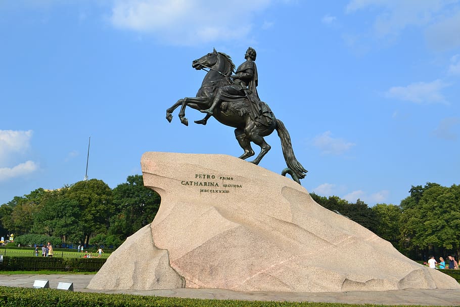 man riding horse statue under blue cloudy sky, st petersburg