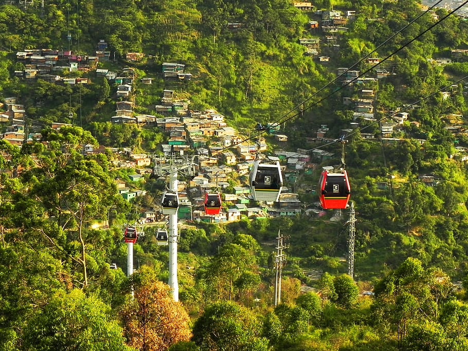 cable cart surrounded trees, medellin, colombia, slum, metrocable