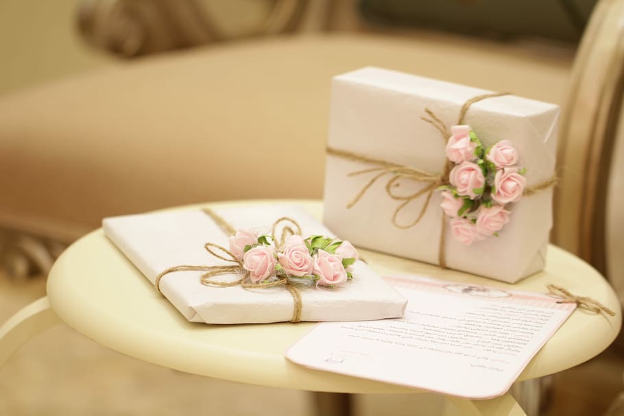 gift, two white-and-pink floral gift boxes on white wooden table HD wallpaper
