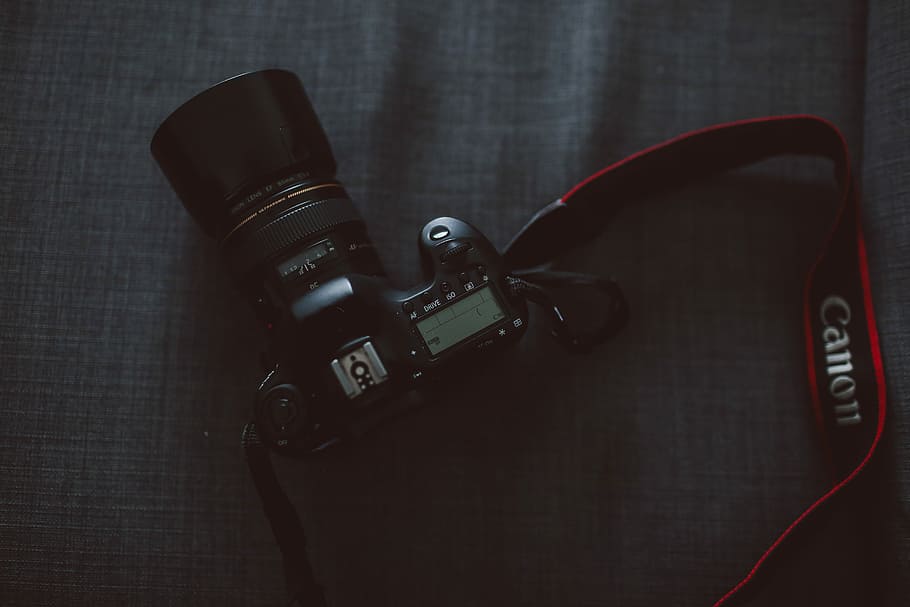 black Canon DSLR camera, black Canon DSLR camera on gray textile HD wallpaper